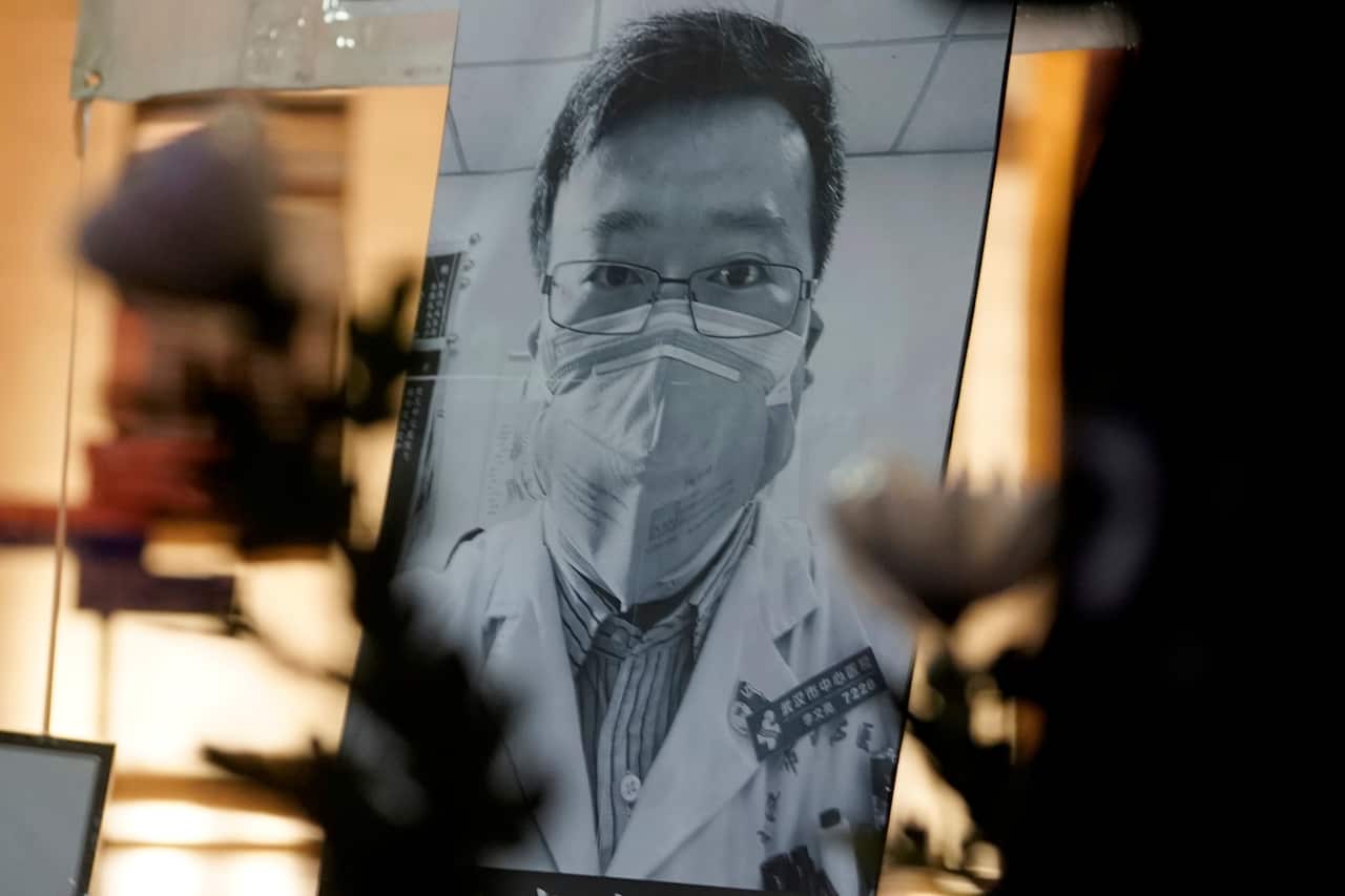 A photo of Chinese doctor Li Wenliang as people attend a vigil in Hong Kong, Friday, Feb. 7, 2020. 
