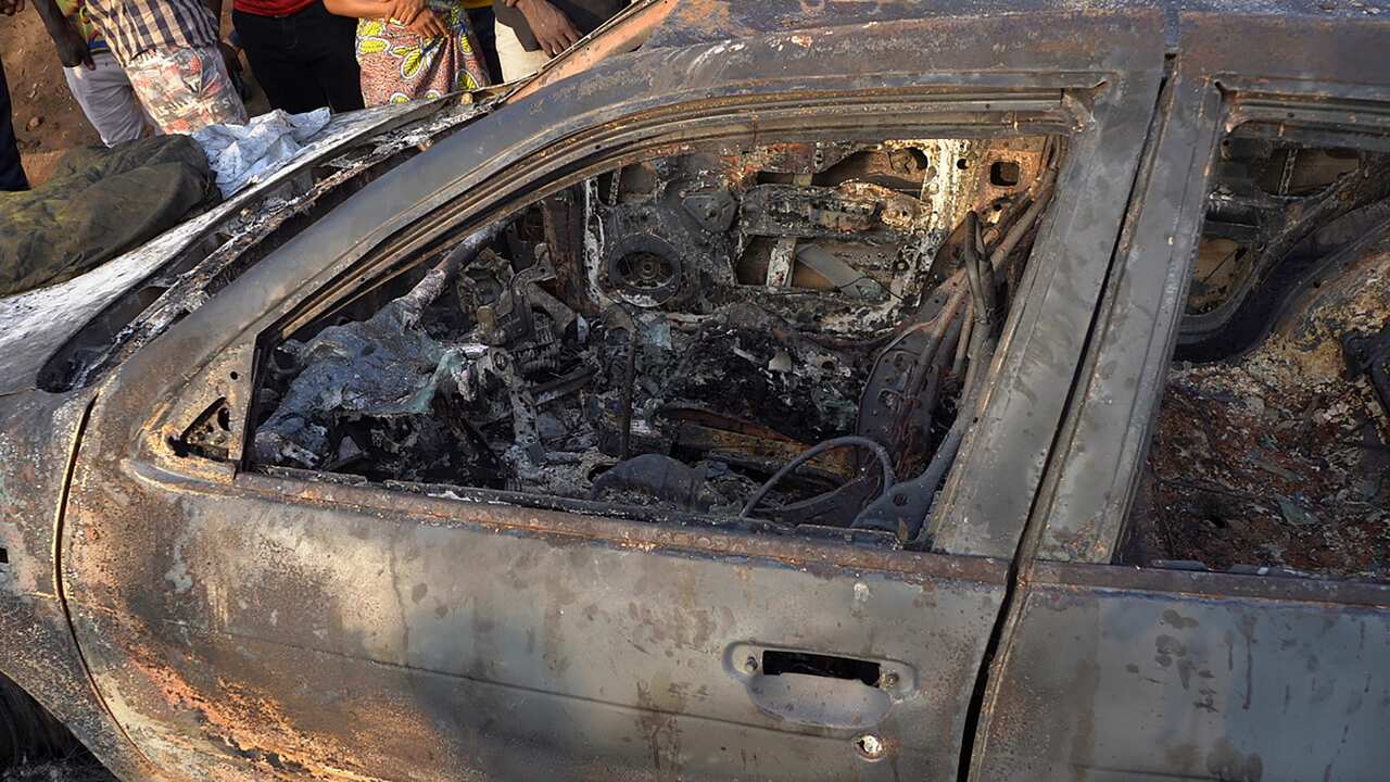 A general view of a burned vehicle in the aftermath of the explosion
