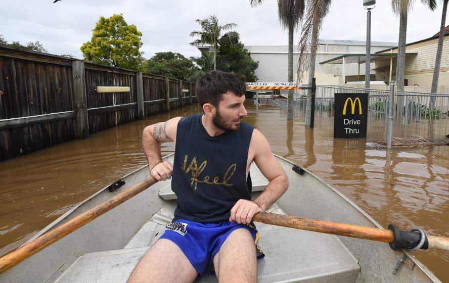 Lennon Bartlett rows through the McDonald's drive-through in central Lismore, New South Wales, 