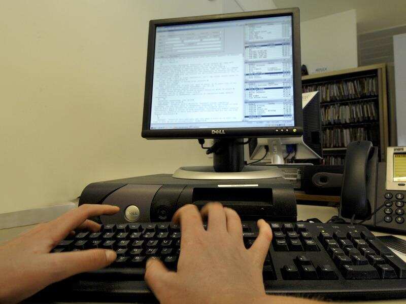 Stock photo of office worker using a compute
