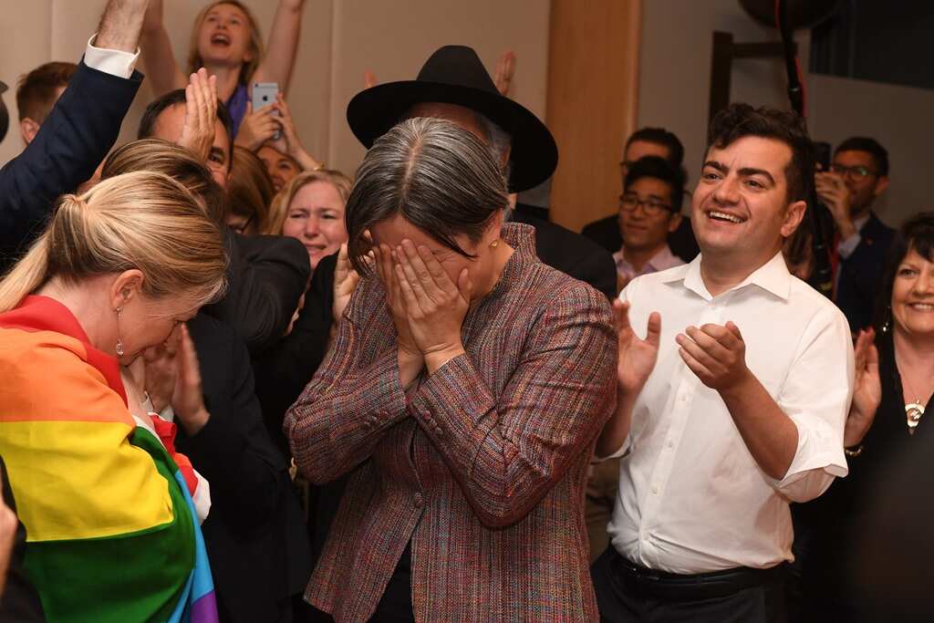 Senator Penny Wong reacts as she joins Parliamentarians as they watch a live broadcast of the announcement of the results of the Marriage Equality survey 