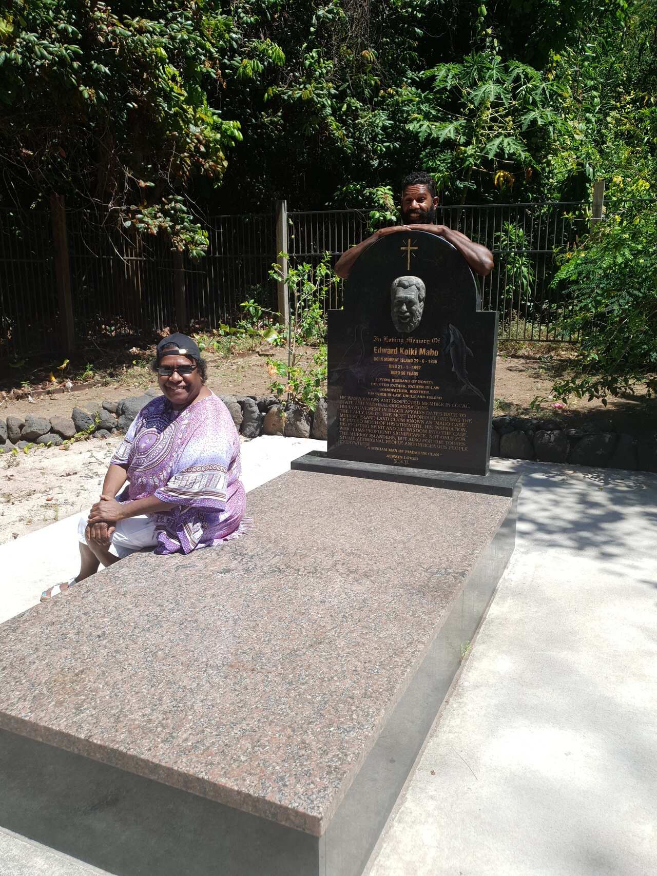 Kaleb and his mother Gail Mabo recreate an old photo at the grave site of Eddie Mabo.