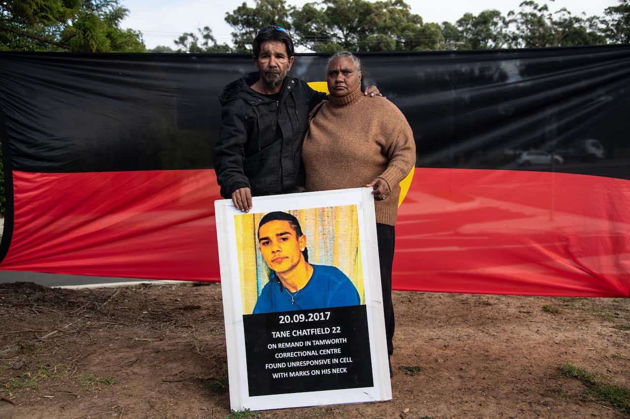 Tane Chatfields parents Colin and Nioka Chatfield pose for a photograph outside the inquest into Tane Chatfields death in custody.