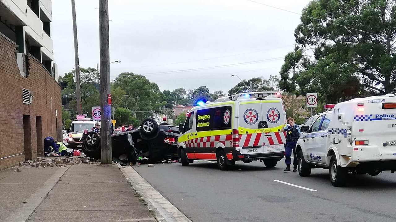 Driver crashes through Eastwood car park brick wall