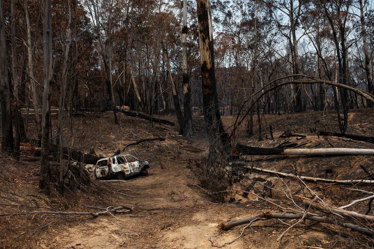 A burnt-out car is seen on a property in Verona, New South Wales, after bushfires tore through the region on New Years Eve 2019.