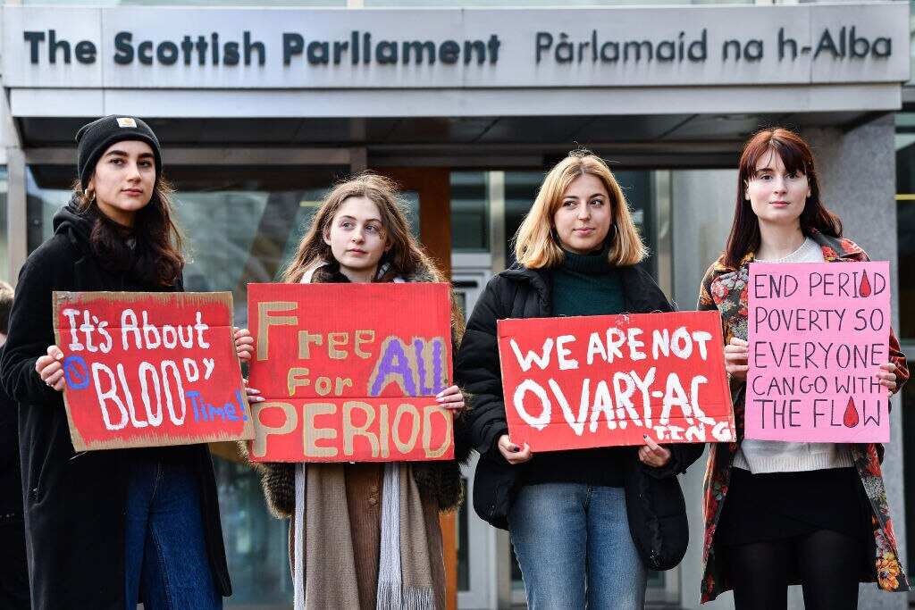 the Scottish parliament has approved plans to make sanitary products freely available, making it the first country in the world to do so.