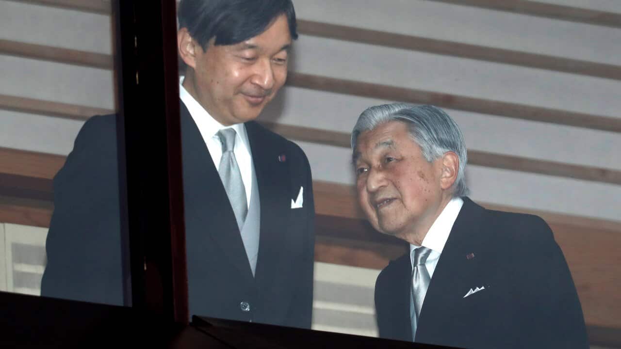 Japan's Emperor Akihito, right, accompanied by Crown Prince Naruhito.