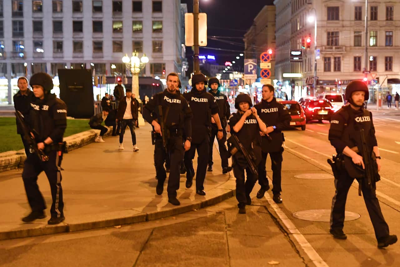 Armed police arrive at the first district near the state opera in central Vienna following a shooting near a synagogue.