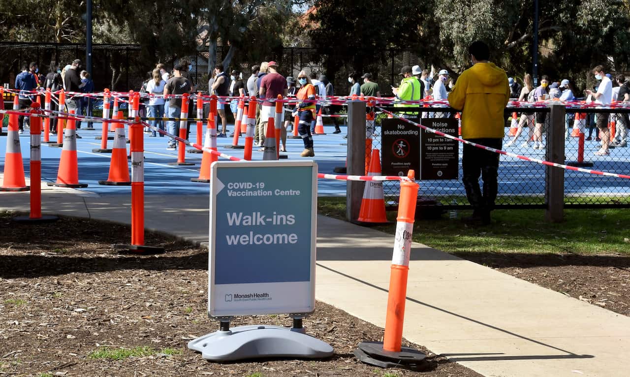 People queue at a Covid-19 vaccination centre in Melbourne