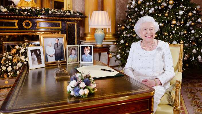 Britain's Queen Elizabeth sits at a desk in the 1844 Room at Buckingham Palace