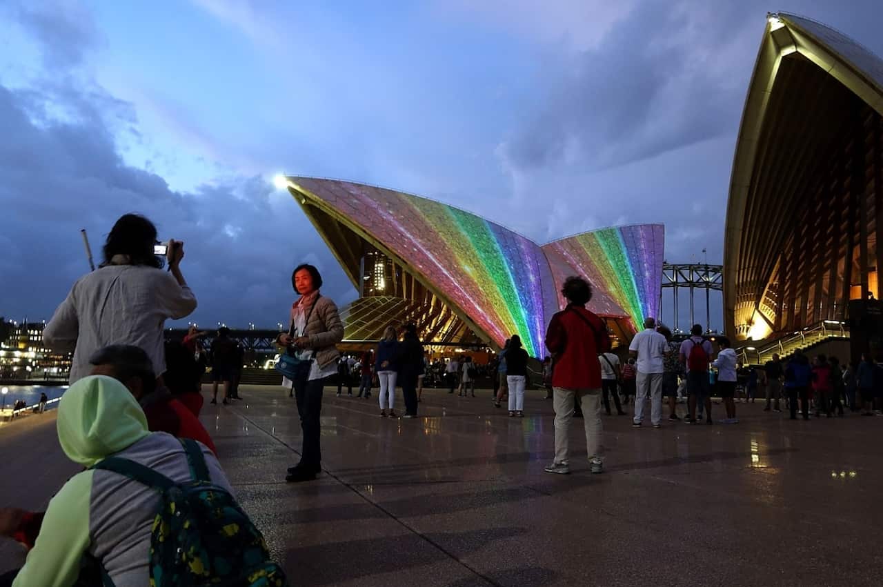 The sails of the Sydney Opera House are lit up to celebrate the passing of the same-sex marriage laws which where passed through federal parliament yesterday