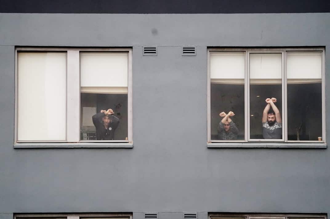 Refugees participate in a "Free The Refugees" rally at the Mantra Hotel in Melbourne.