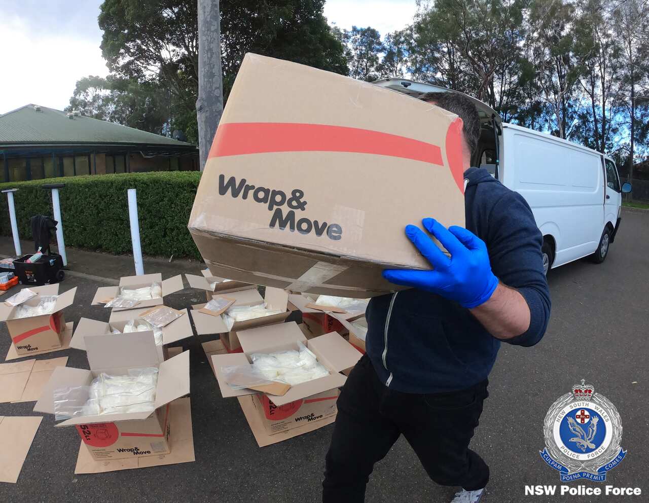 Police allegedly uncovered numerous boxes filled with drugs in the back of the van. 