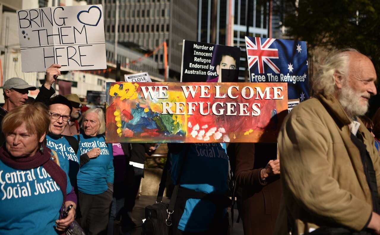 Demonstrators march during a protest to demand humane treatment of asylum seekers and refugees, in Sydney.