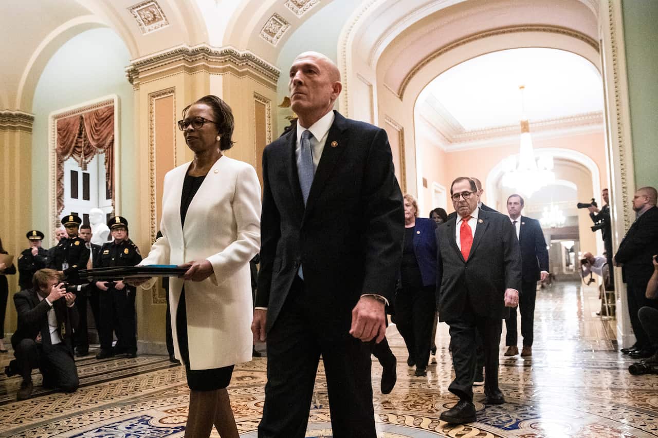 The impeachment articles were delivered to the Senate in a solemn procession. 