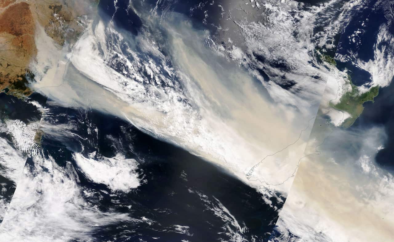 A satellite image showing smoke originating from bushfires burning in Australia drifting over New Zealand