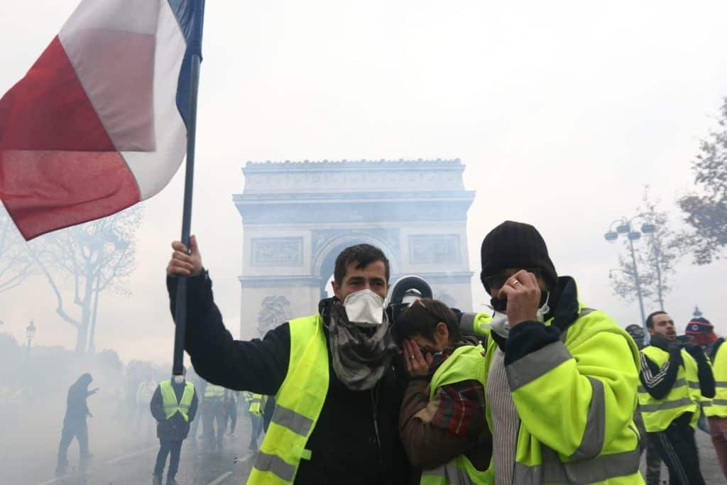 Yellow vest protest against rising fuel taxes in Paris.