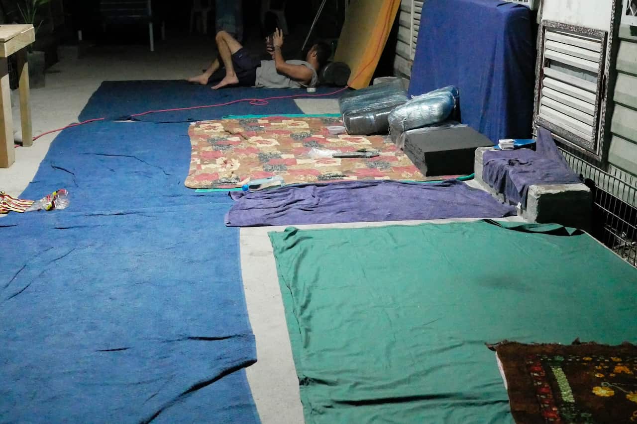 Makeshift beds line the floor in a camp at the former Manus Island detention centre.