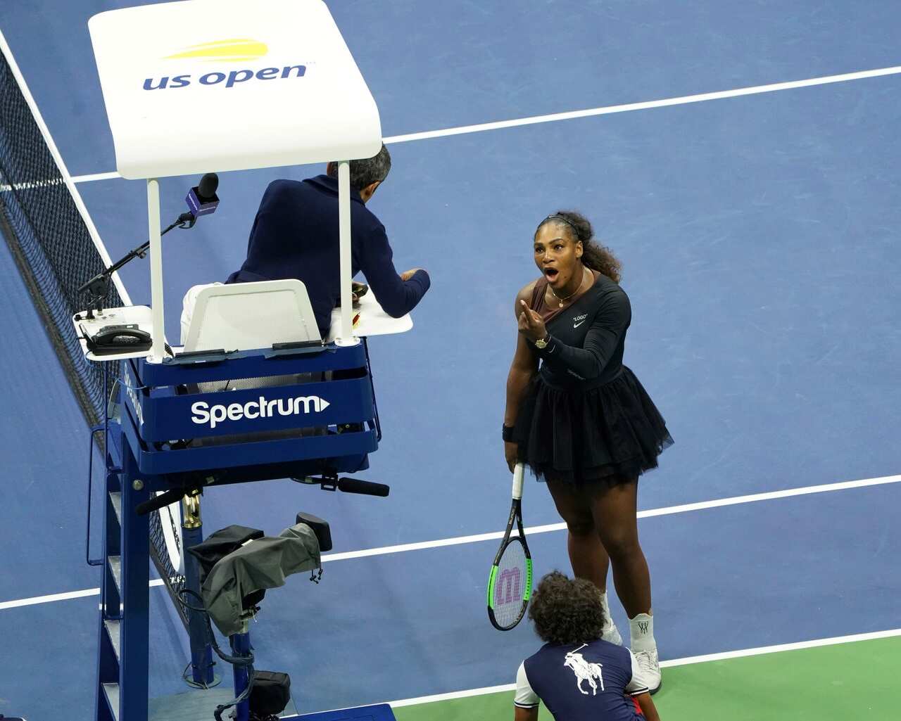 Serena Williams argues with chair umpire Carlos Ramos over his decision to deduct a game.