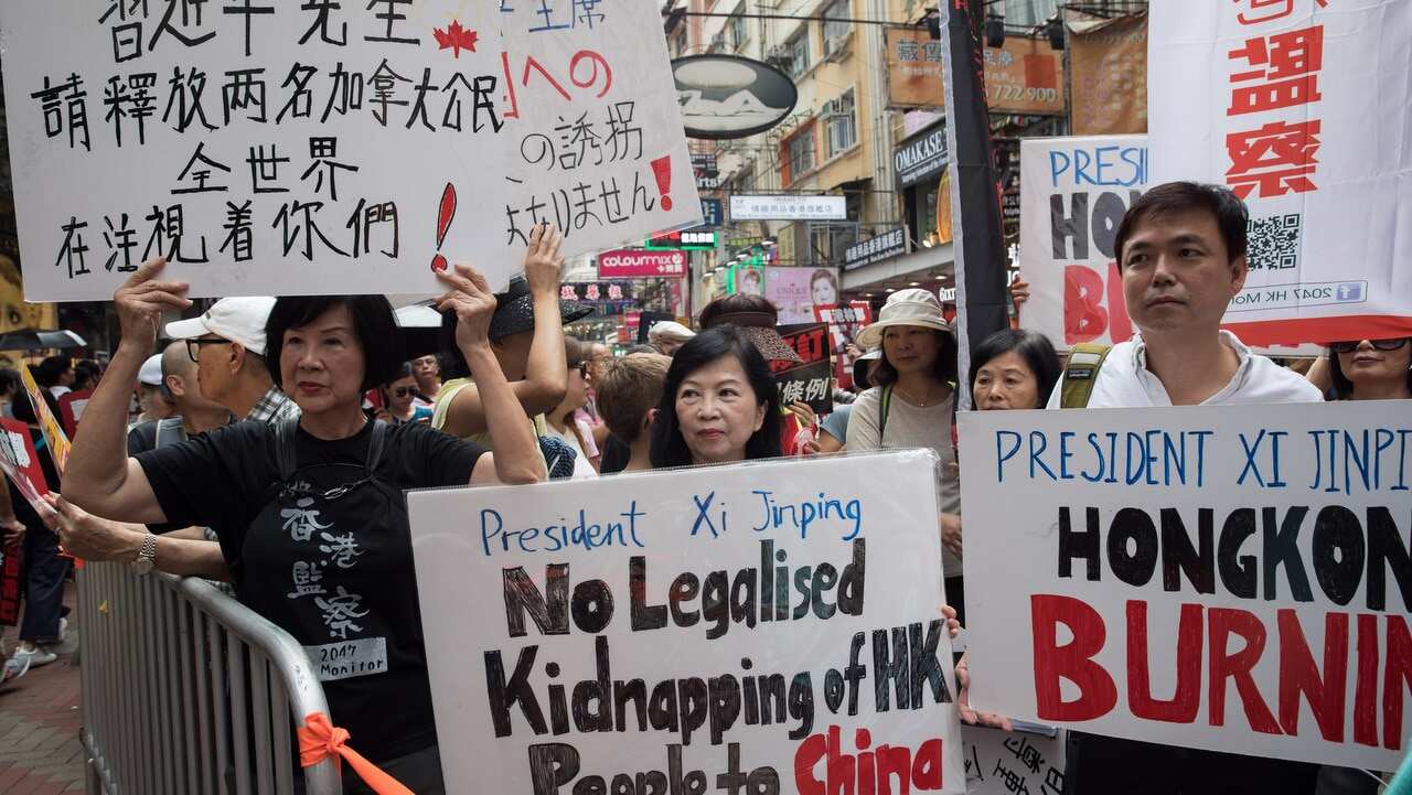 Pro-democracy activists take part in a march against a proposed extradition law in Hong Kong,28 April 2019. 