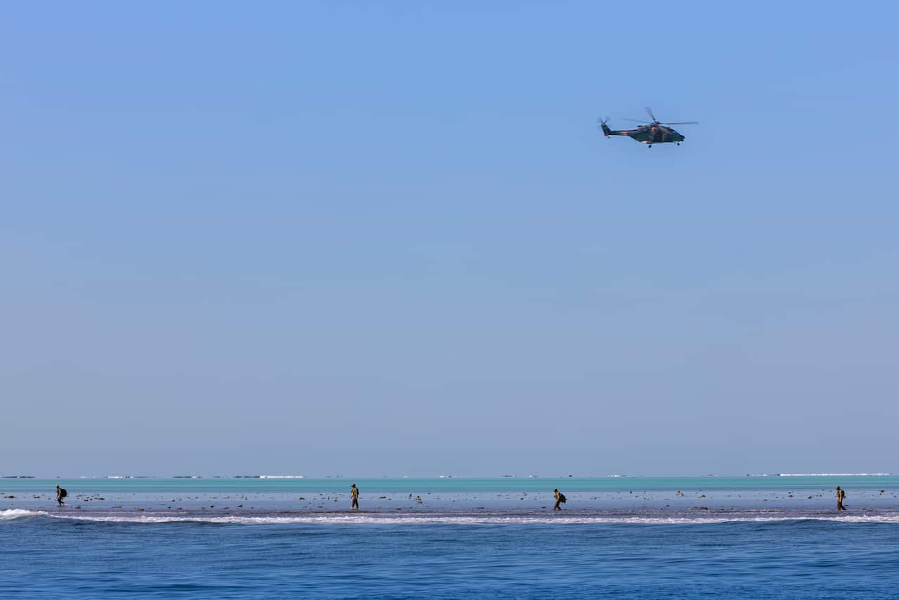Australian Clearance Diving Team One search the unexploded ordnance in the vicinity of Elizabeth Reef.  