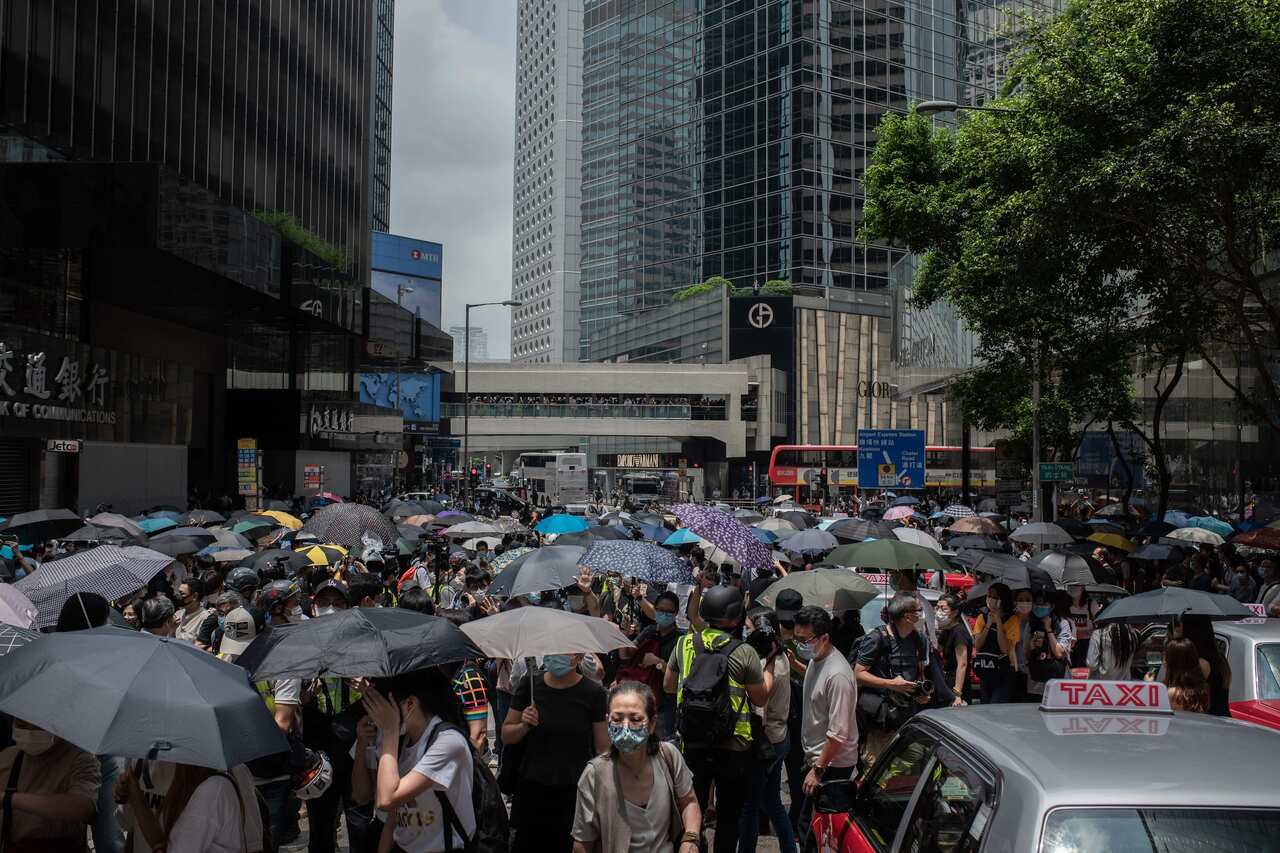 Protesters block a Hong Kong street during a demonstration against the national security law. 