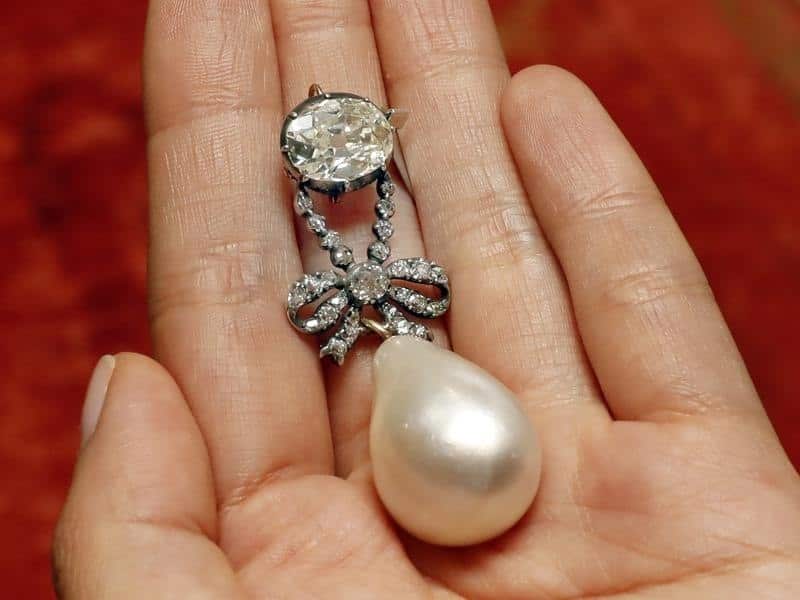The Queen Marie Antoinette Pearl and diamond pendant have sold for $US32 million. 