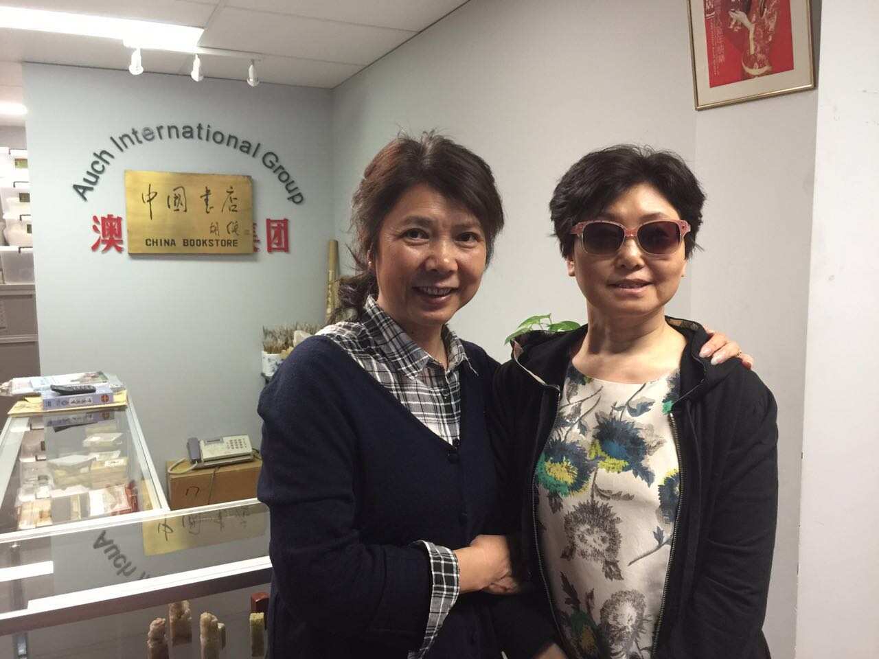 Wendy Liu and her friend standing inside bookstore. 