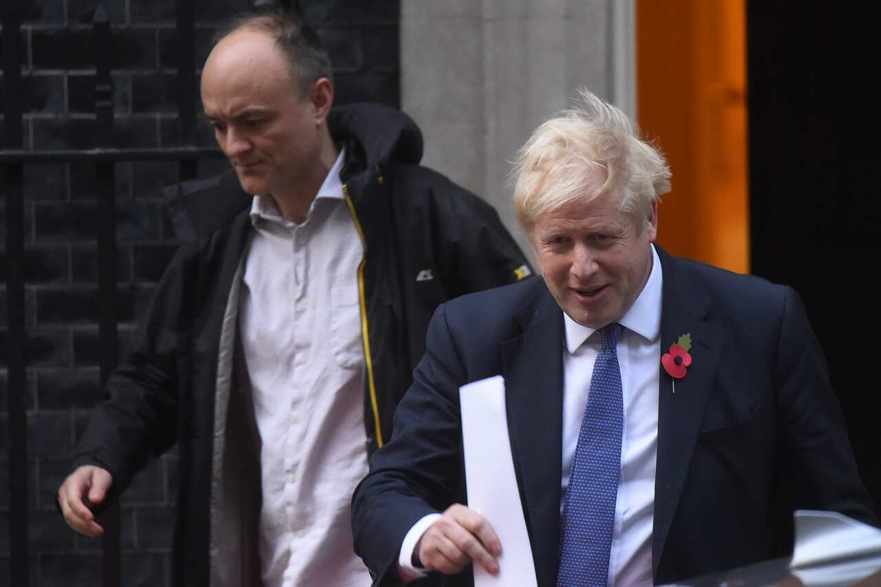Prime Minister Boris Johnson and his political advisor Dominic Cummings leave 10 Downing Street.