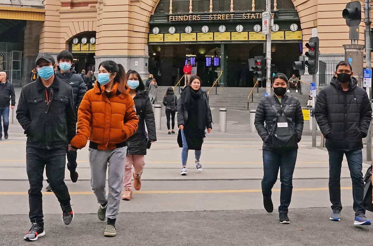 People leave Flinders Street Stationi n Melbourne, Sunday, 21 June, 2020.