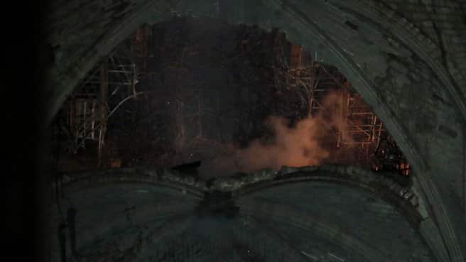 Photos Inside Notre Dame Show Charred Alter With A Hanging Cross Intact