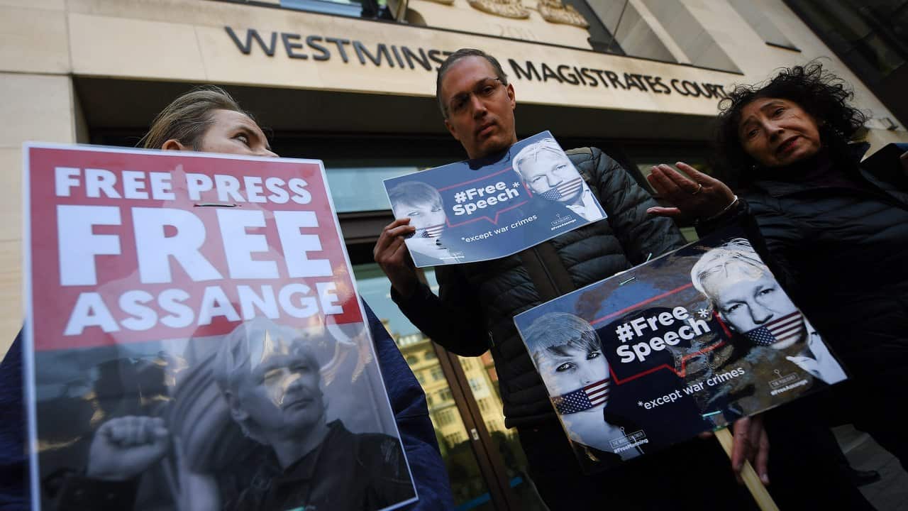 Supporters of Wikileaks founder Julian Assange rally for his release outside of the Westminster Magistrates Court in London.