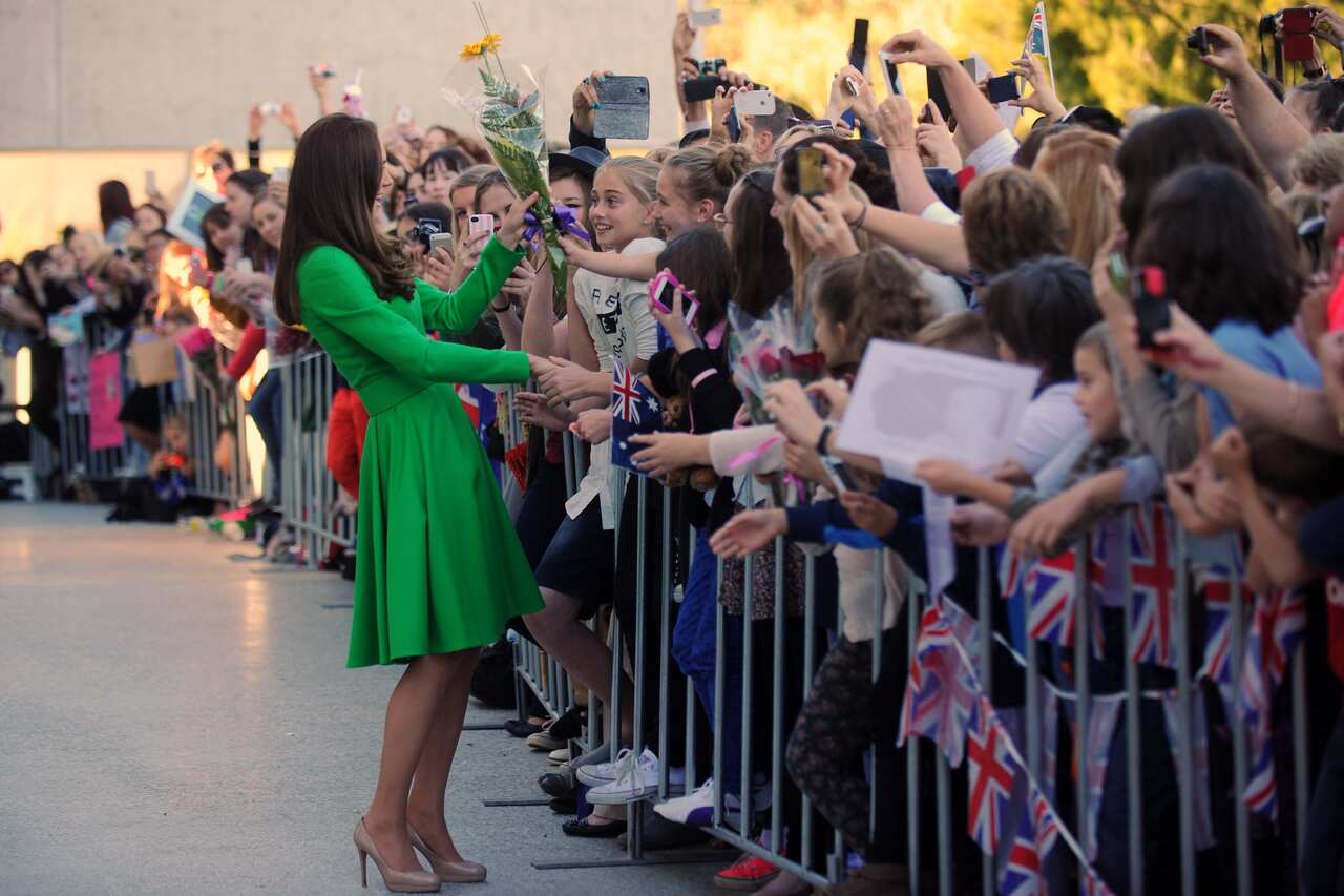 Britain's Kate, Duchess of Cambridge, left, meets well-wishers during a visit to the National Portrait Gallery in Canberra.
