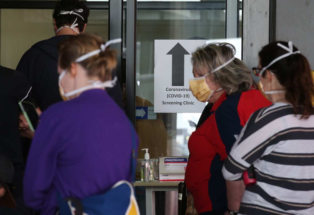 Patients line up at the Royal Melbourne Hospital for Coronavirus testing. Tuesday, 10 March, 2020.