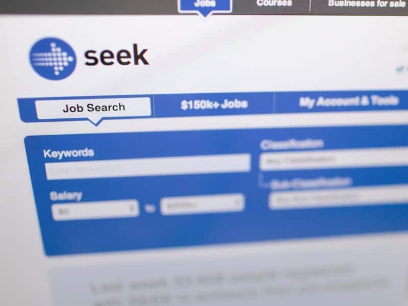 The website of online job search engine 'Seek' is seen on a screen