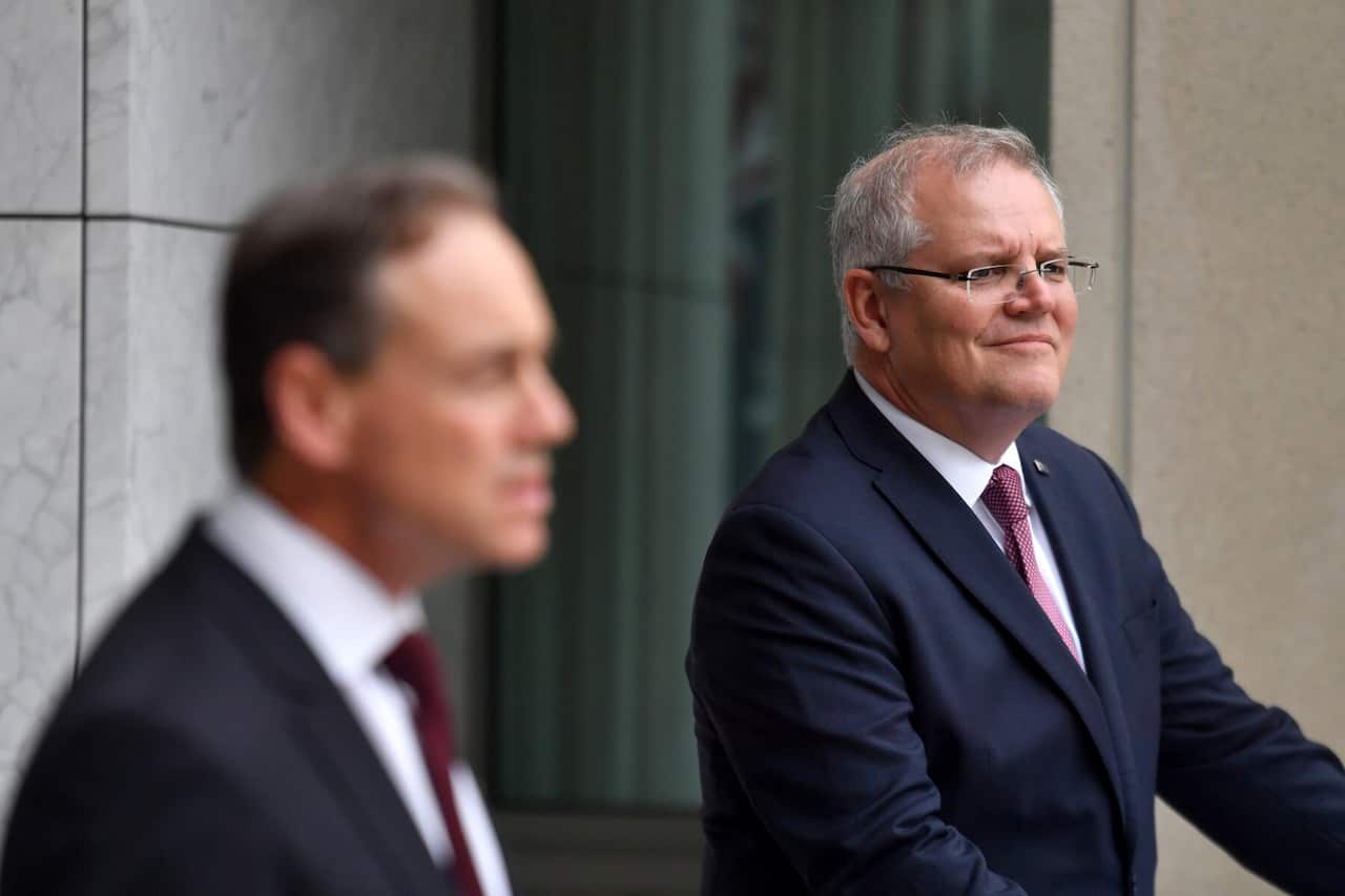 Minister for Health Greg Hunt and Prime Minister Scott Morrison announce the government's $1.1bn health and family violence package at a press conference at Parliament House in Canberra, Sunday, March 29, 2020. (AAP Image/Mick Tsikas) NO ARCHIVING