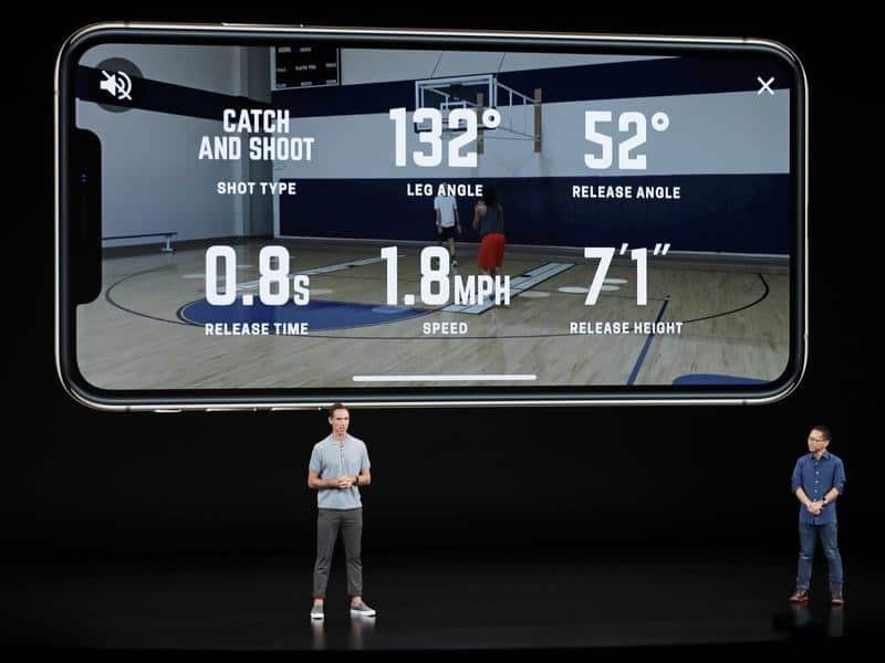 Presenters at the Apple event talk about the new phones