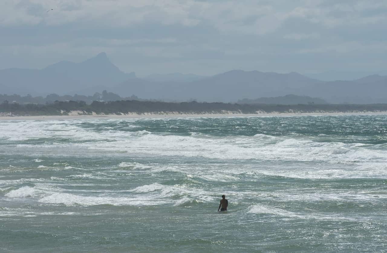 A swimmer is seen near Clarkes Beach at Byron Bay.