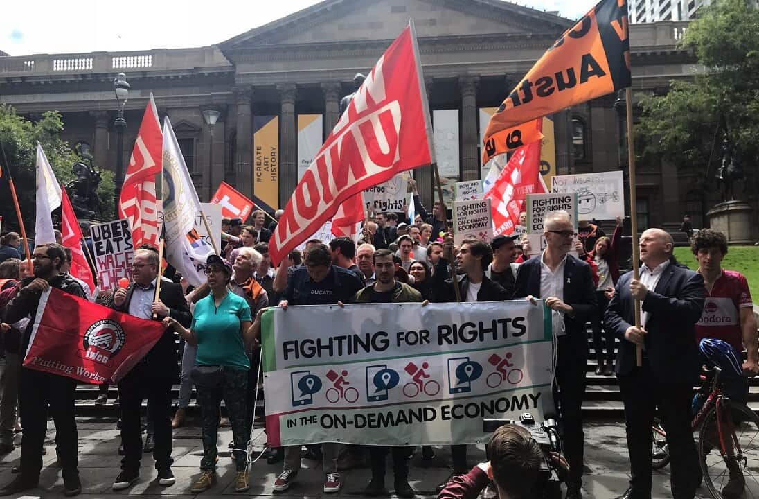 Hundreds protest against poor pay and conditions of food delivery riders in Melbourne.