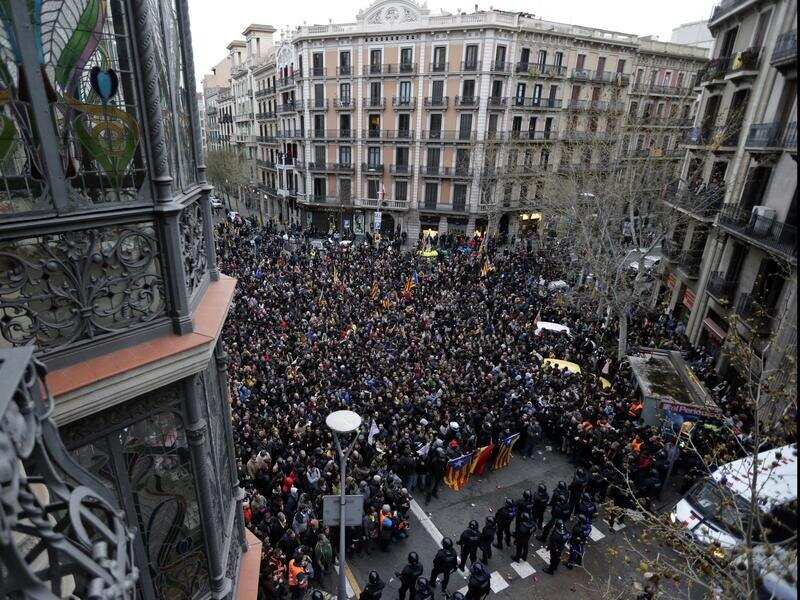 Police hold back demonstrators in Barcelona