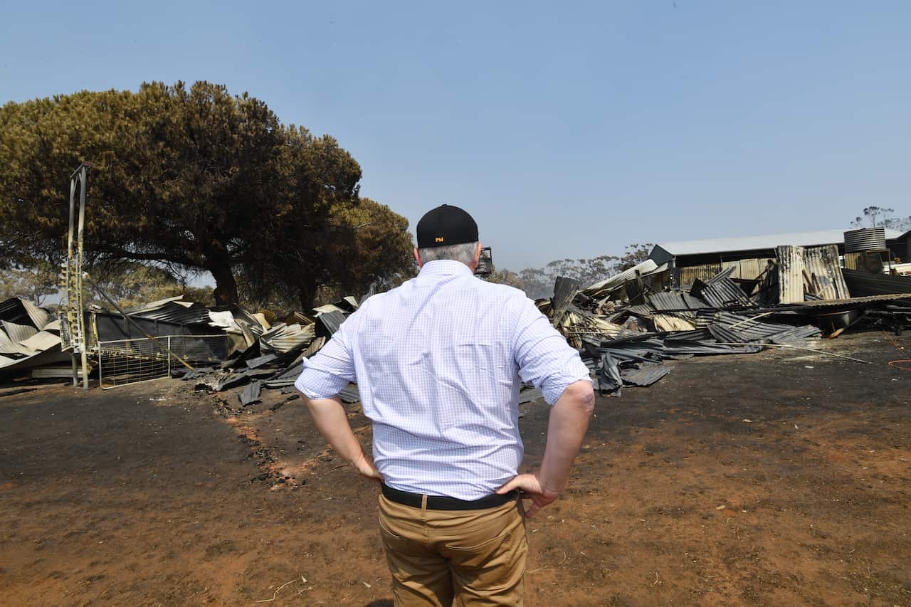 Prime Minister Scott Morrison surveys the damage at Stokes Bay on Kangaroo Island, southwest of Adelaide.