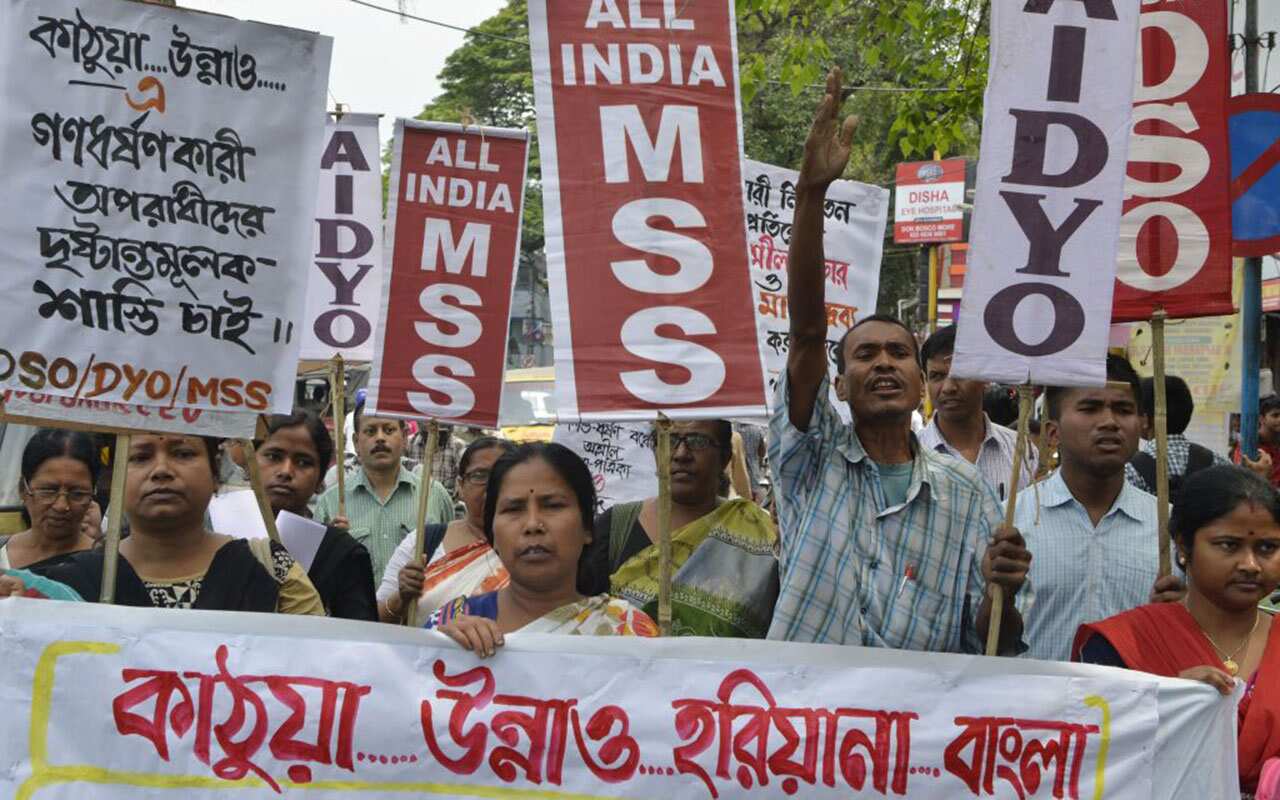 Indian activists shout anti-government slogans as they protest calling for justice following recent rape and murder cases.