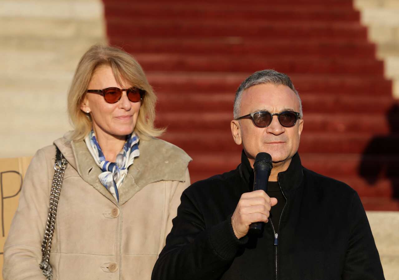 Diana (L) and Srdjan Djokovic (R) address a rally in support of their son, Serbian tennis player Novak Djokovic, in Belgrade, Serbia.
