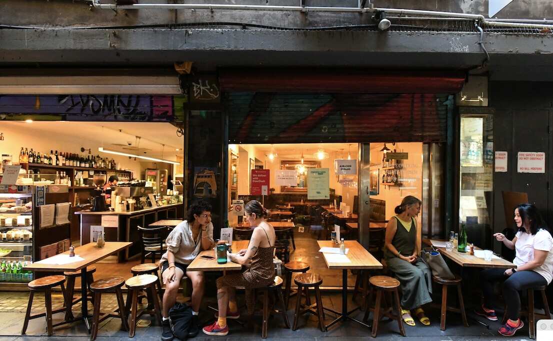 People are seen at a cafe in Centre Place, Melbourne, in February 2021.