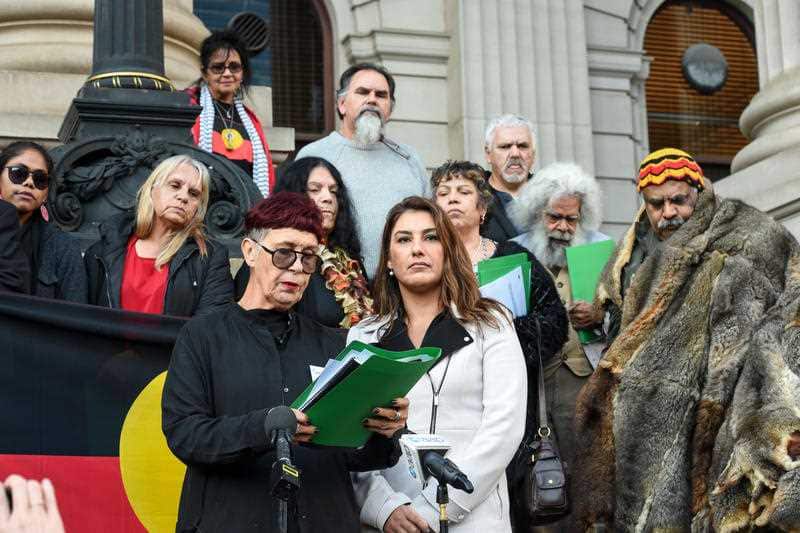 Carolyn Briggs, Victorian Greens spokesperson for Aboriginal Affairs Lidia Thorpe and Aboriginal elders speak outside the Victorian parliament