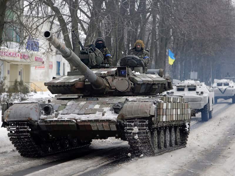 Ukrainian forces vehicles drive in Volnovakha city