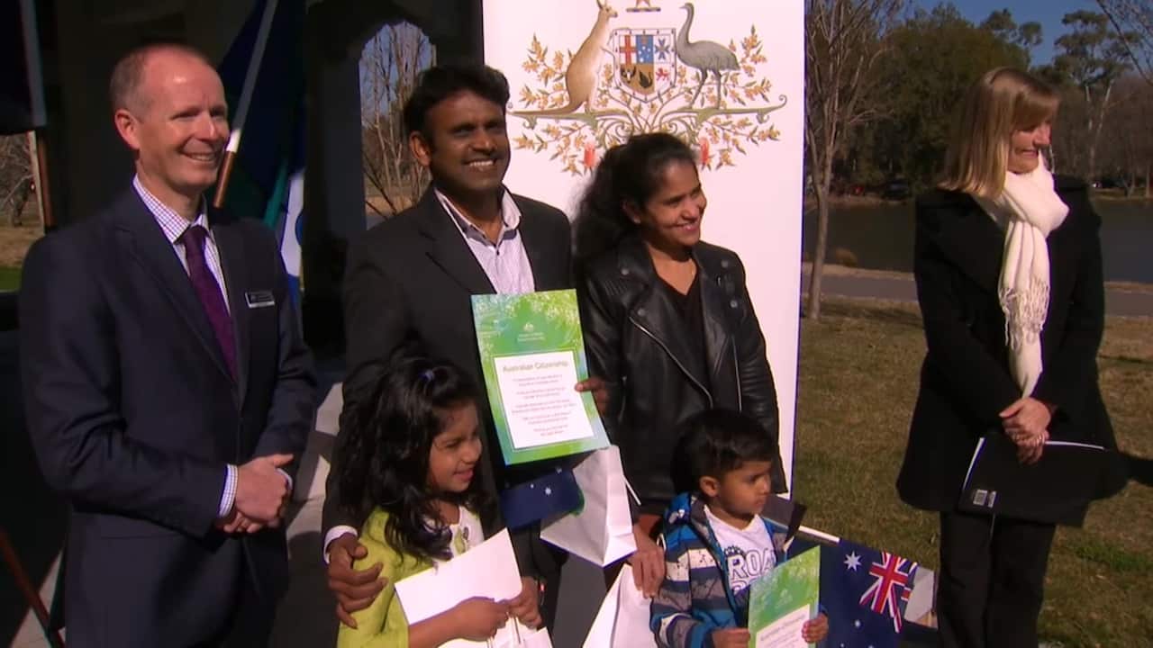 Dinesh Kumar and his family at the citizenship ceremony in Canberra on Friday. 