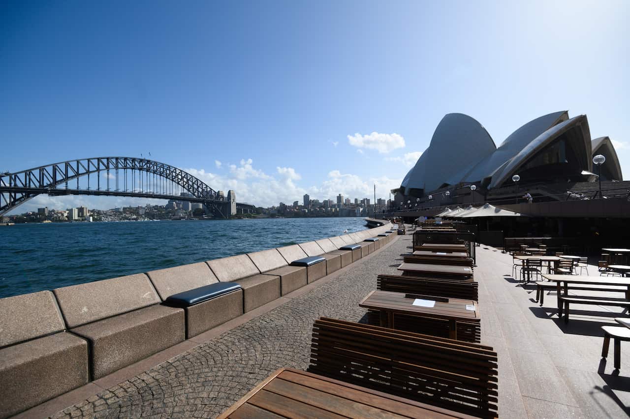 Empty tables at the Sydney's Opera Bar restaurant, Sydney on Saturday. 