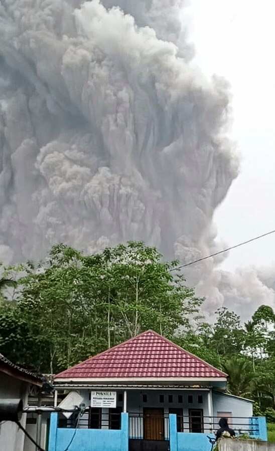Mount Semeru spews volcanic ash during an eruption in Lumajang, East Java, 4 December 2021. 