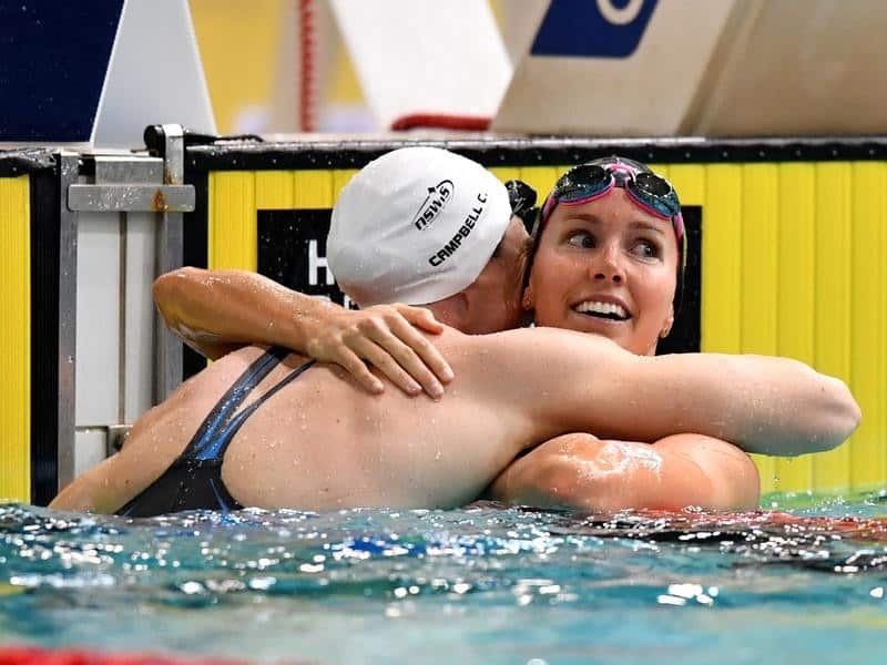 Cate Campbell (l) hugs Emma McKeon after the final of the women's 100m freestyle at the world trials.